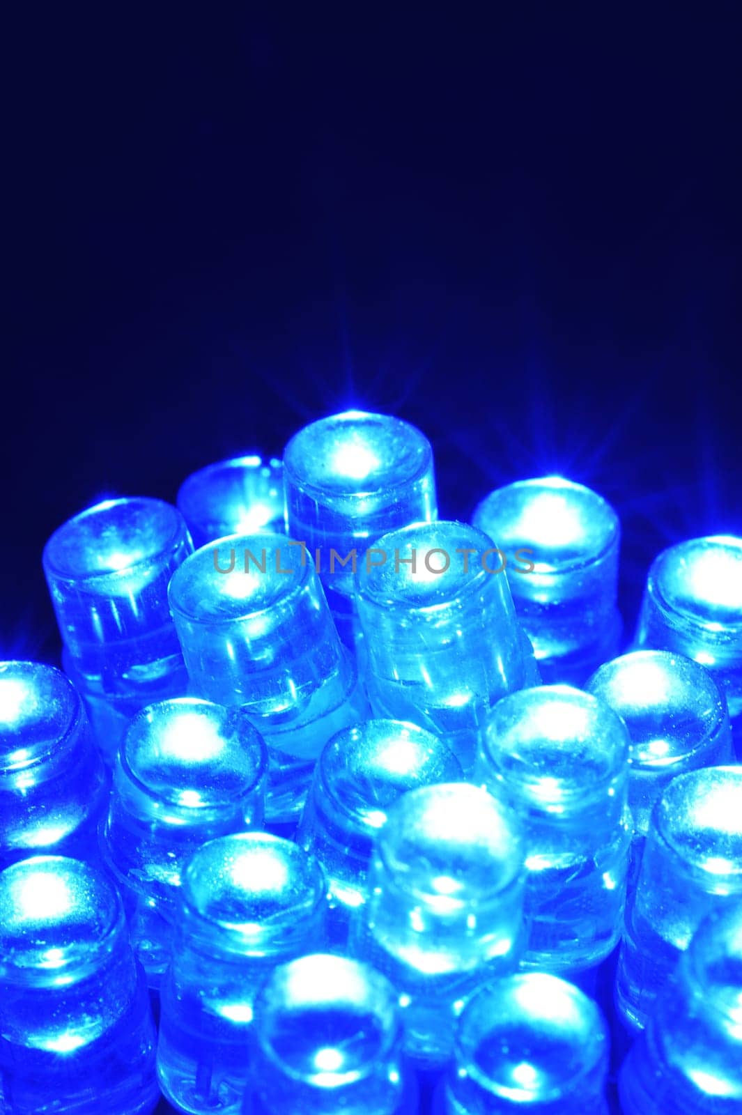 Macrodetail of some blue LEDs in colored light