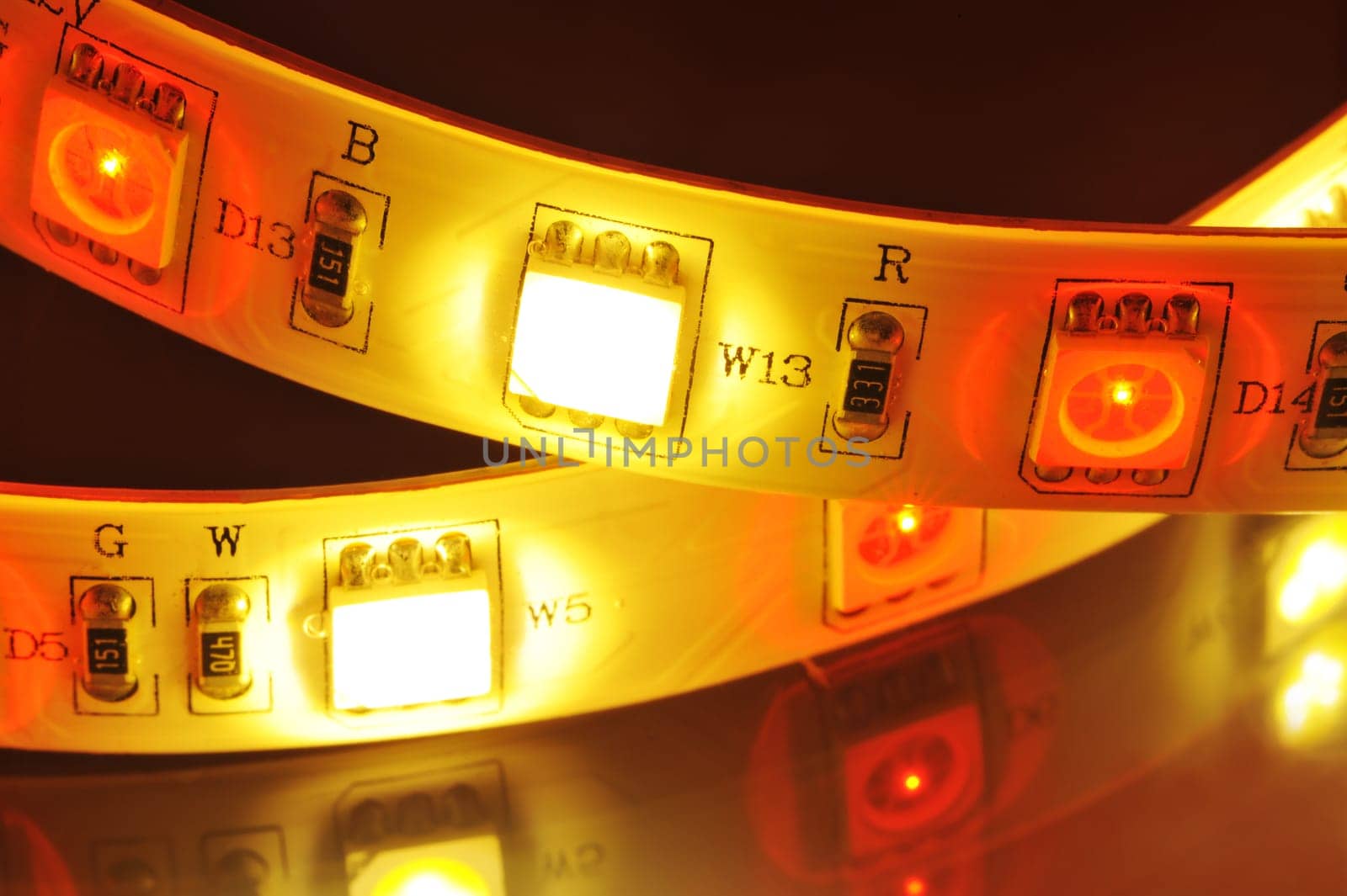Macrodetail of an RGB LED strip combined with warm white LEDs in colored light