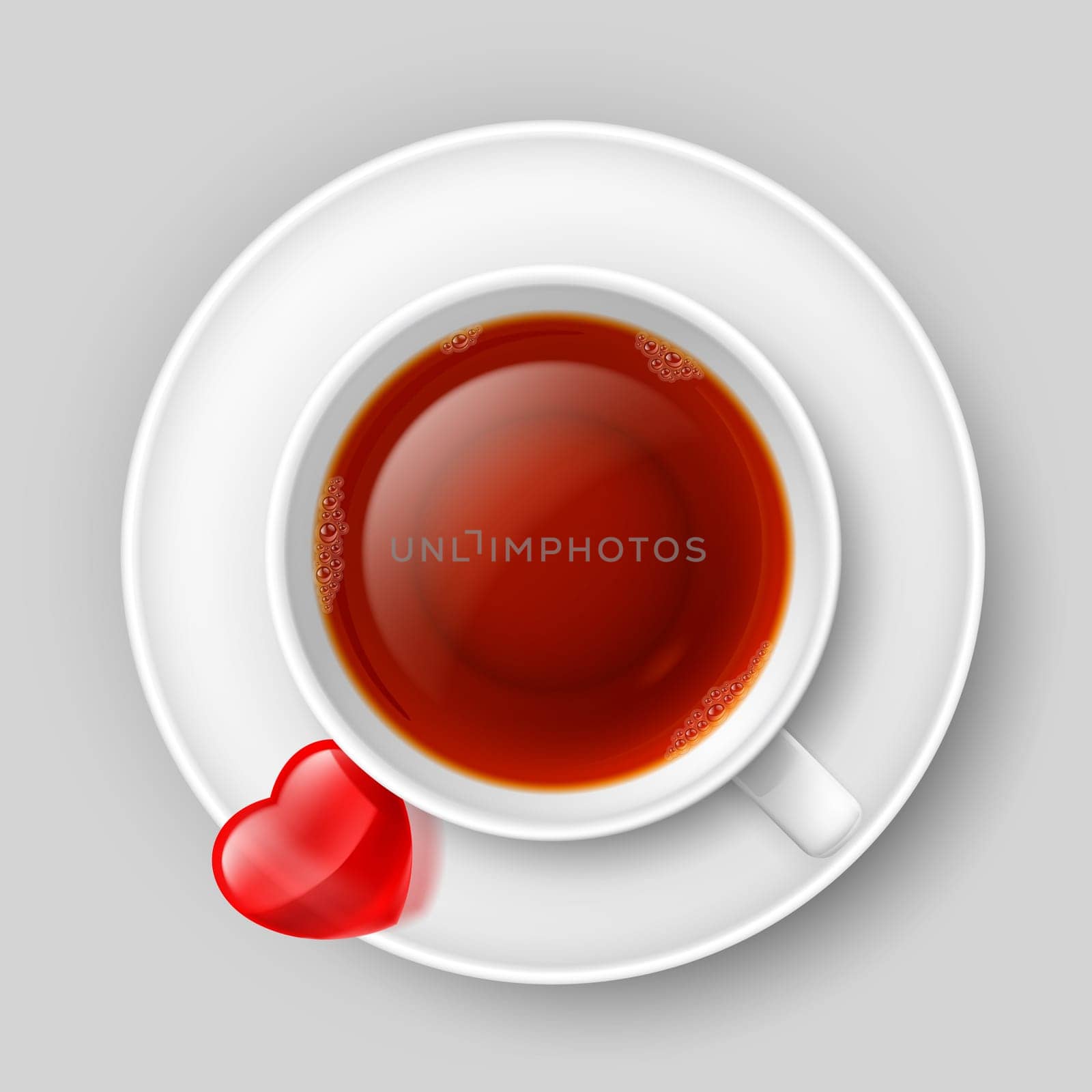 Cup of tea with heart on saucer. Top view