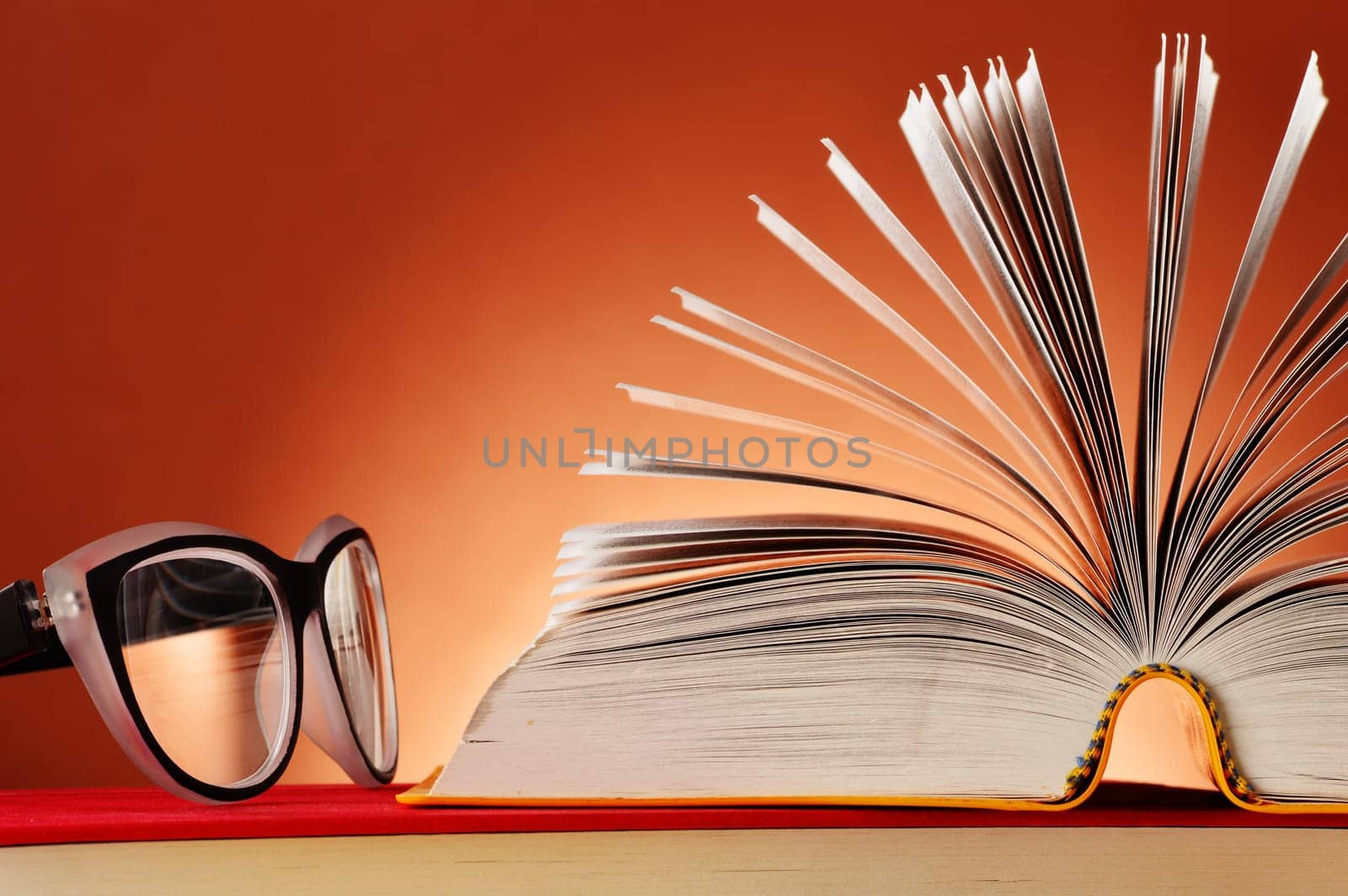 Composition with glasses and books on the table