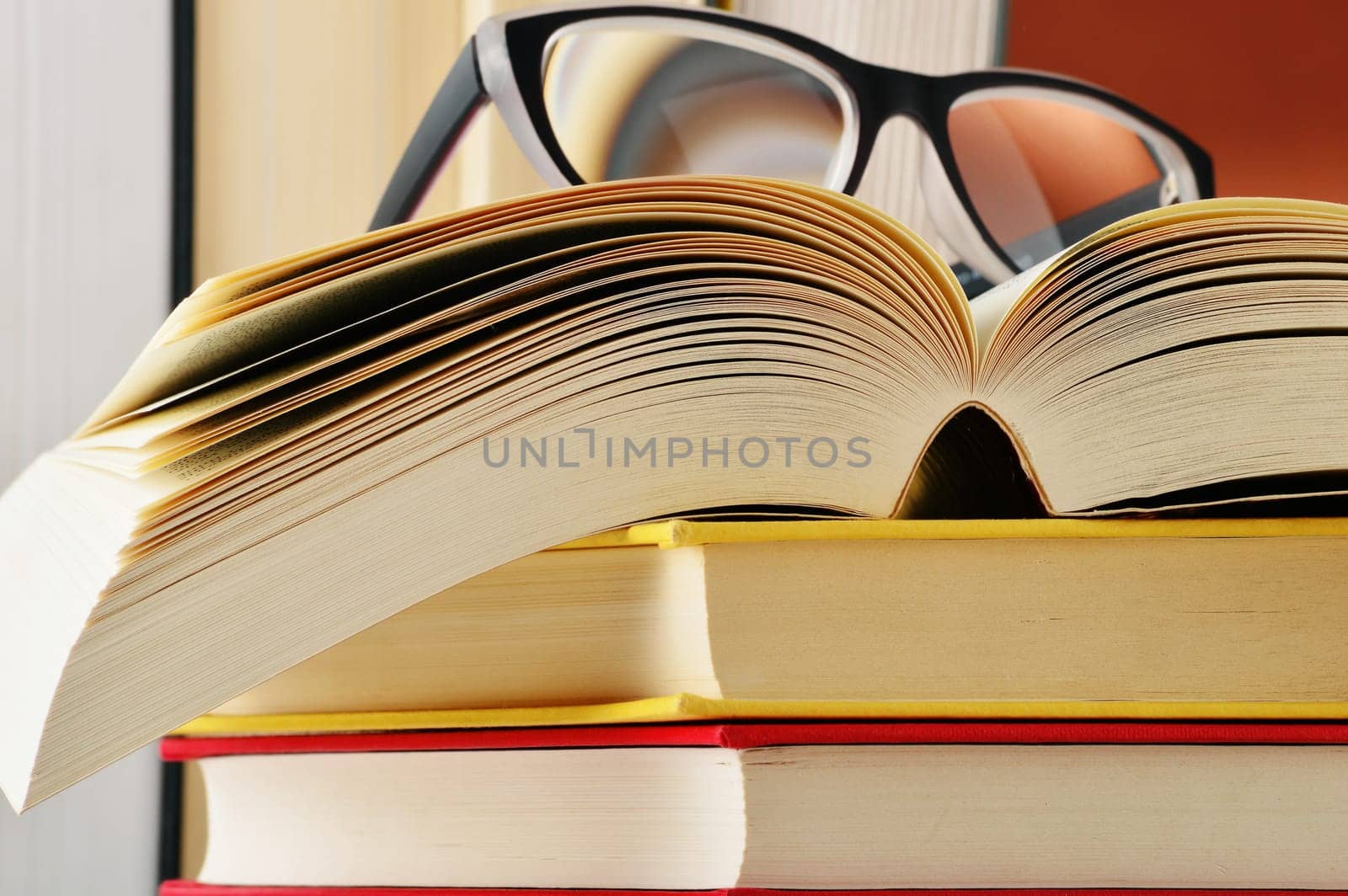 Composition with glasses and books on the table