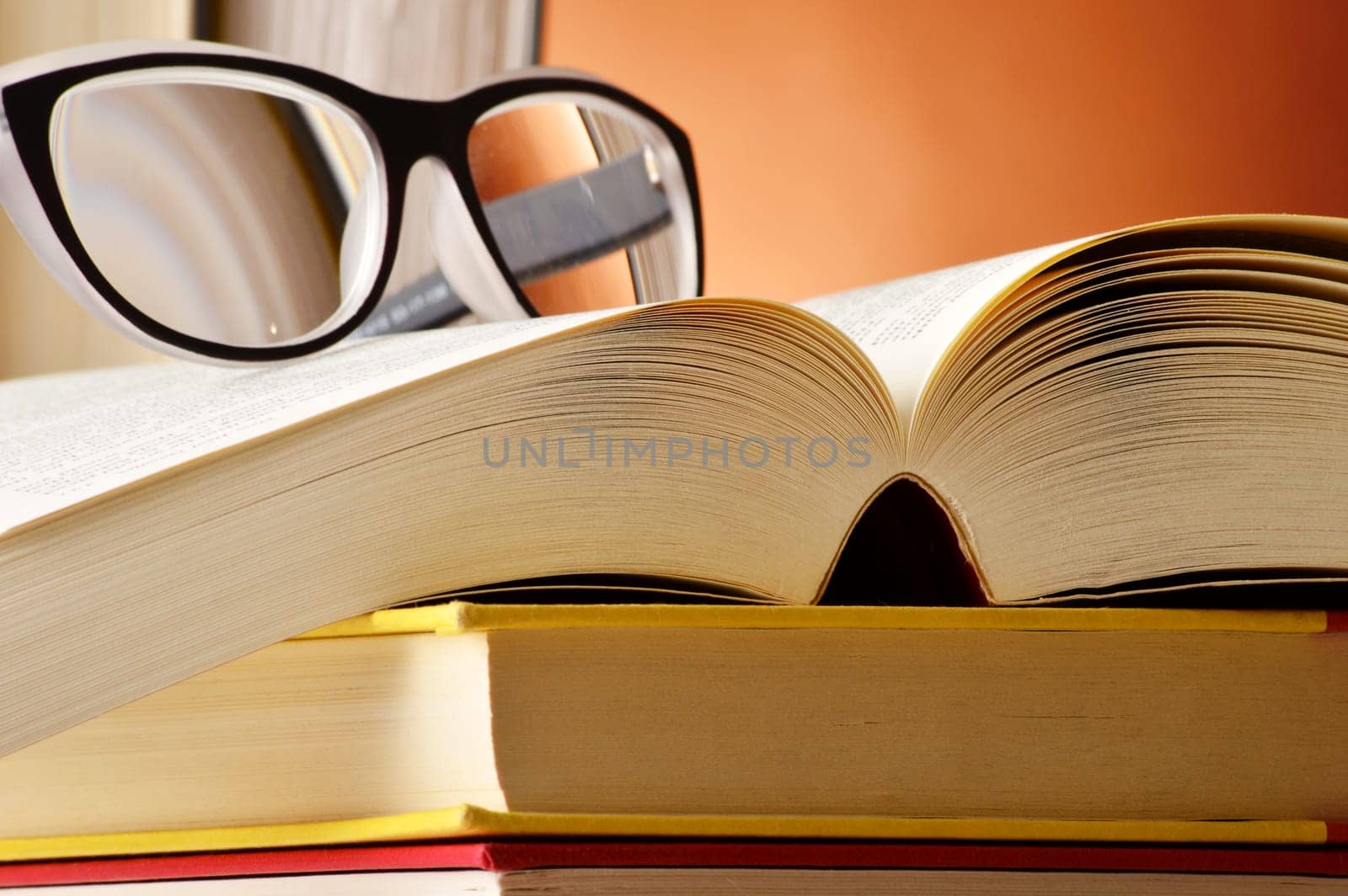Composition with glasses and books on the table