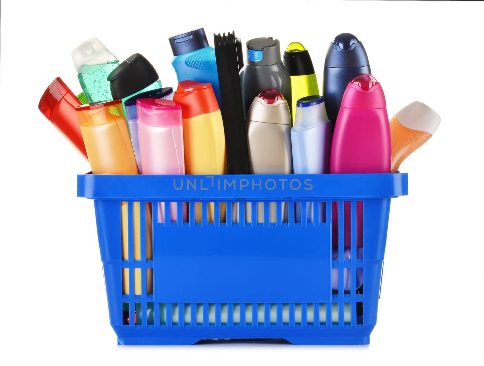 Plastic shopping basket with plastic bottles of body care and beauty products