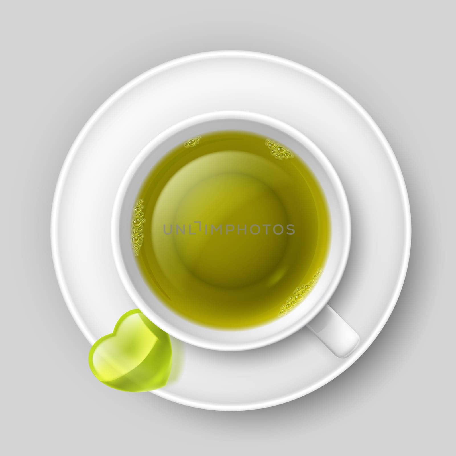 Cup of green tea with heart on saucer. Top view