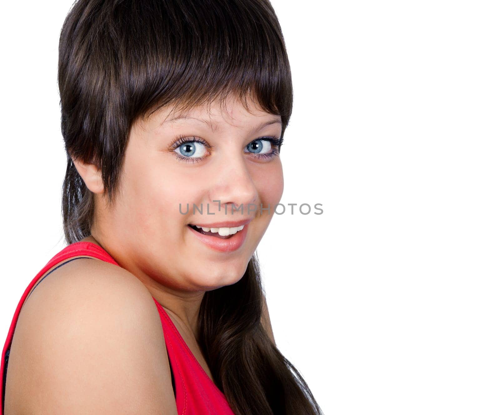 Smiling blue-eyed young girl on a white background. portrait
