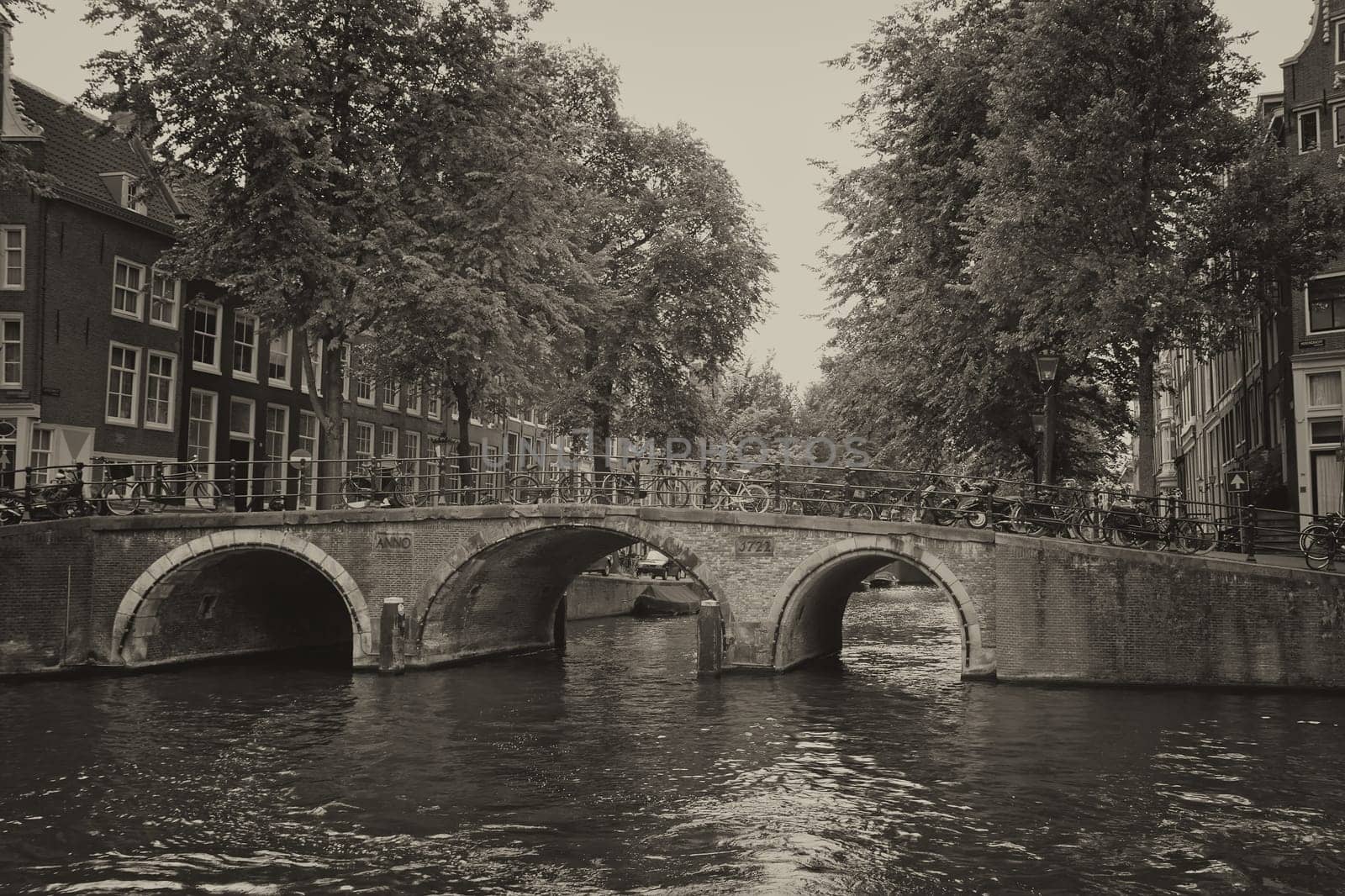 View of the bridge over the canal in the center of Amsterdam (Netherlands).Processed as a vintage photo.