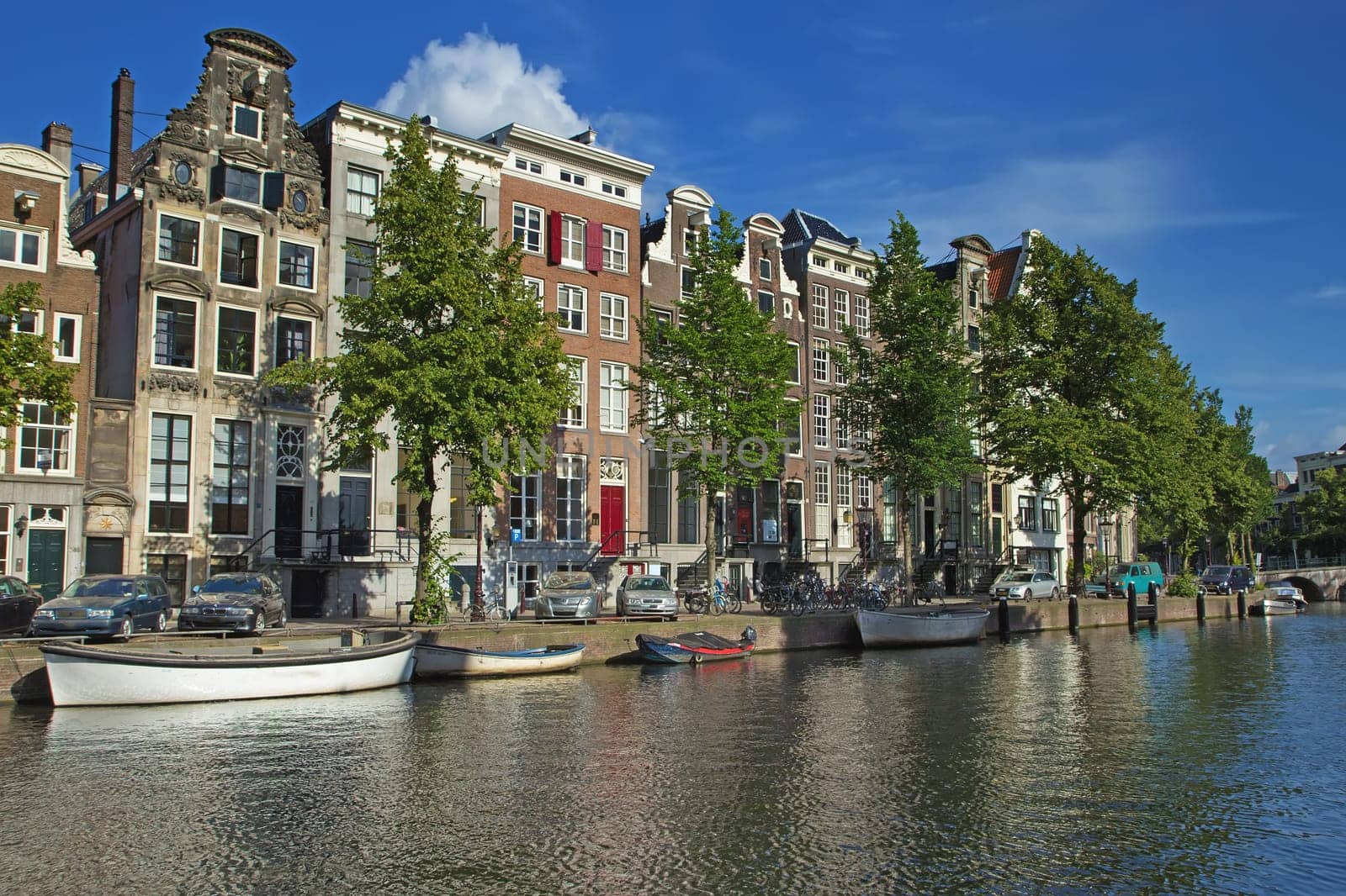 The houses along the canals in Amsterdam. (The Netherlands). All potential trademarks are removed.