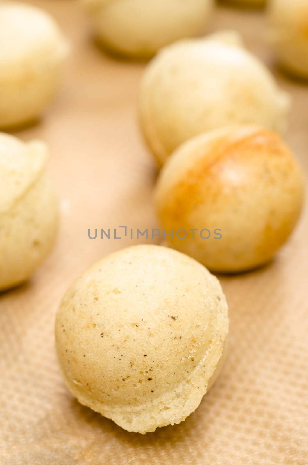 Baked dough as a ball for cake pops in portrait format