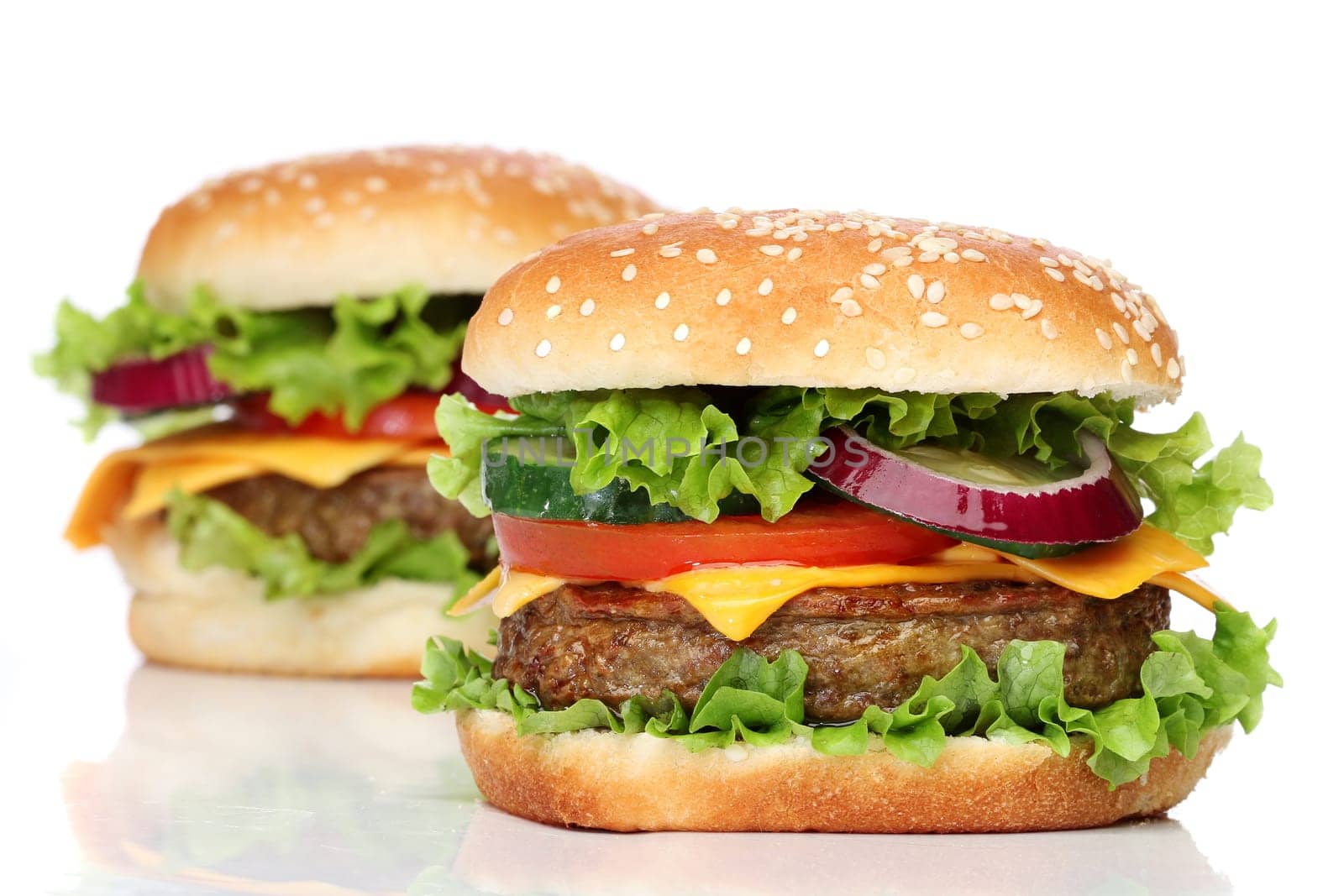 Two delicious hamburgers isolated on white background