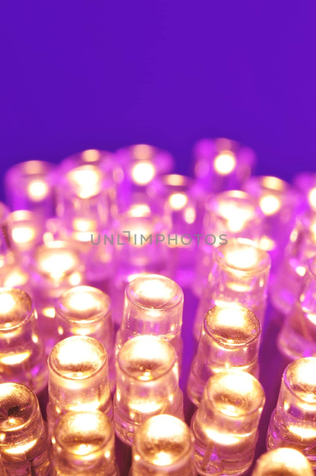 Macrodetail of some warm white LEDs in violet light