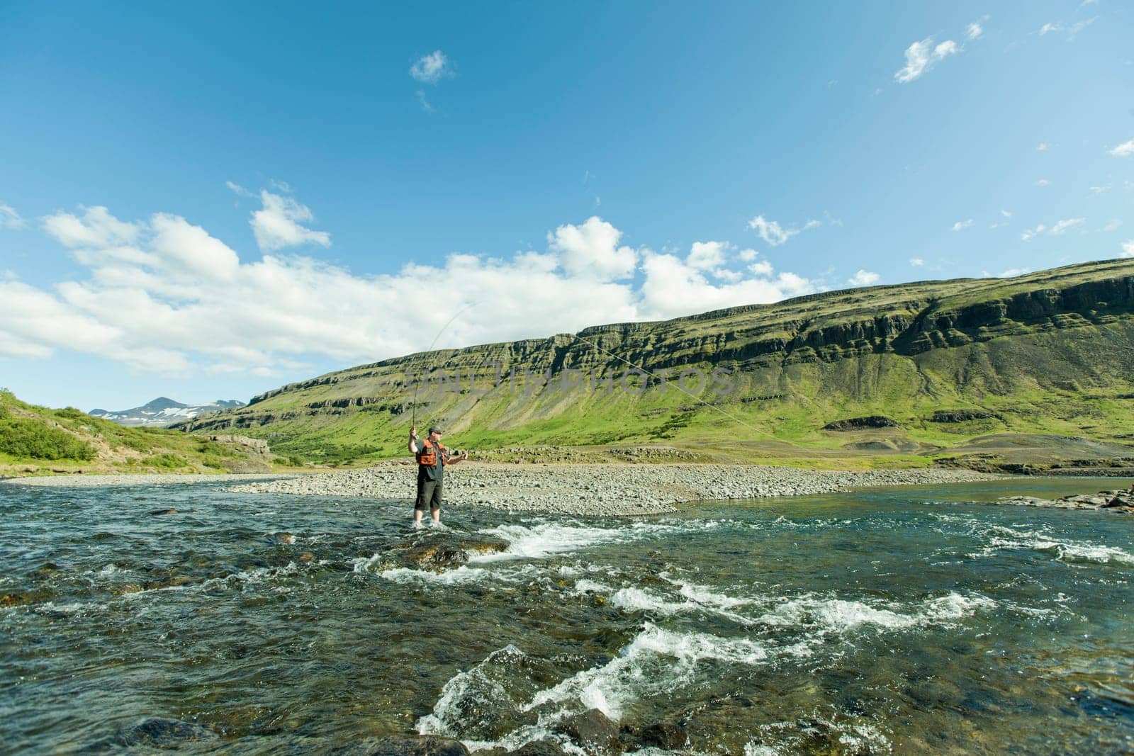 Man fishing for salmon in a beautiful surrounding