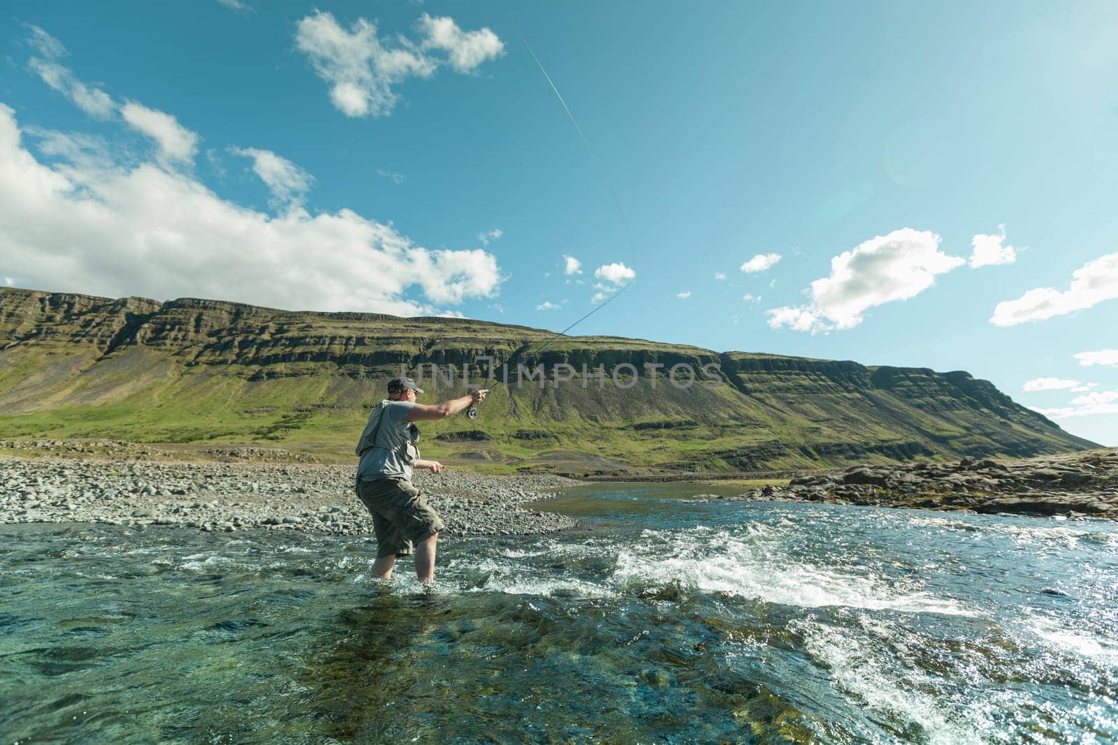 Man fishing for salmon in a beautiful surrounding