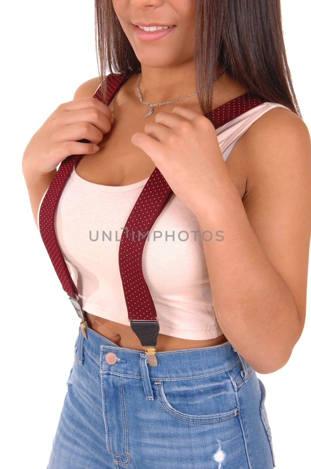 A body part picture of the chest of a young woman in a pink t-shirt.with red suspender on her jeans, isolated on white background..