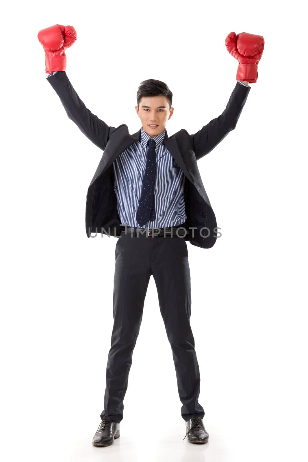 Asian businessman with boxing gloves, full length portrait isolated on white background. Concept about fight, struggle, against etc.