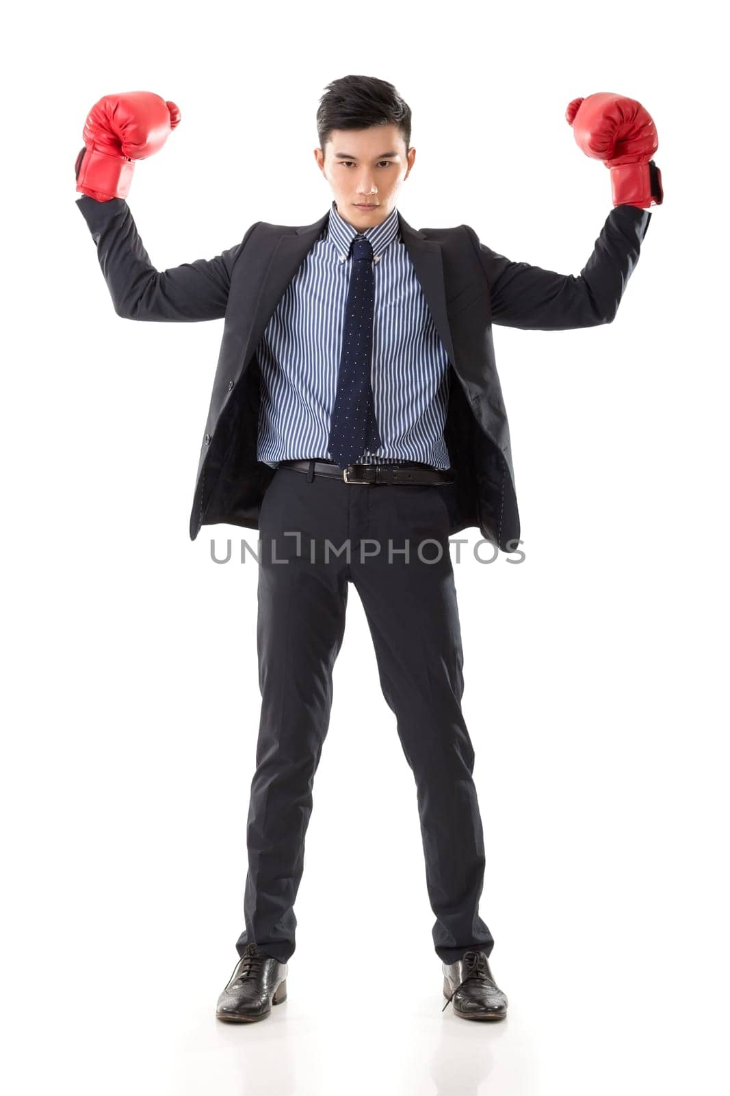 Asian businessman with boxing gloves, full length portrait isolated on white background. Concept about fight, struggle, against etc.