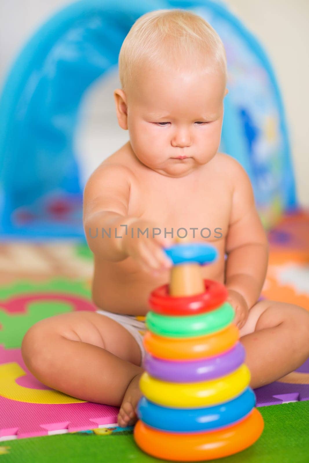 Cute baby is playing toy