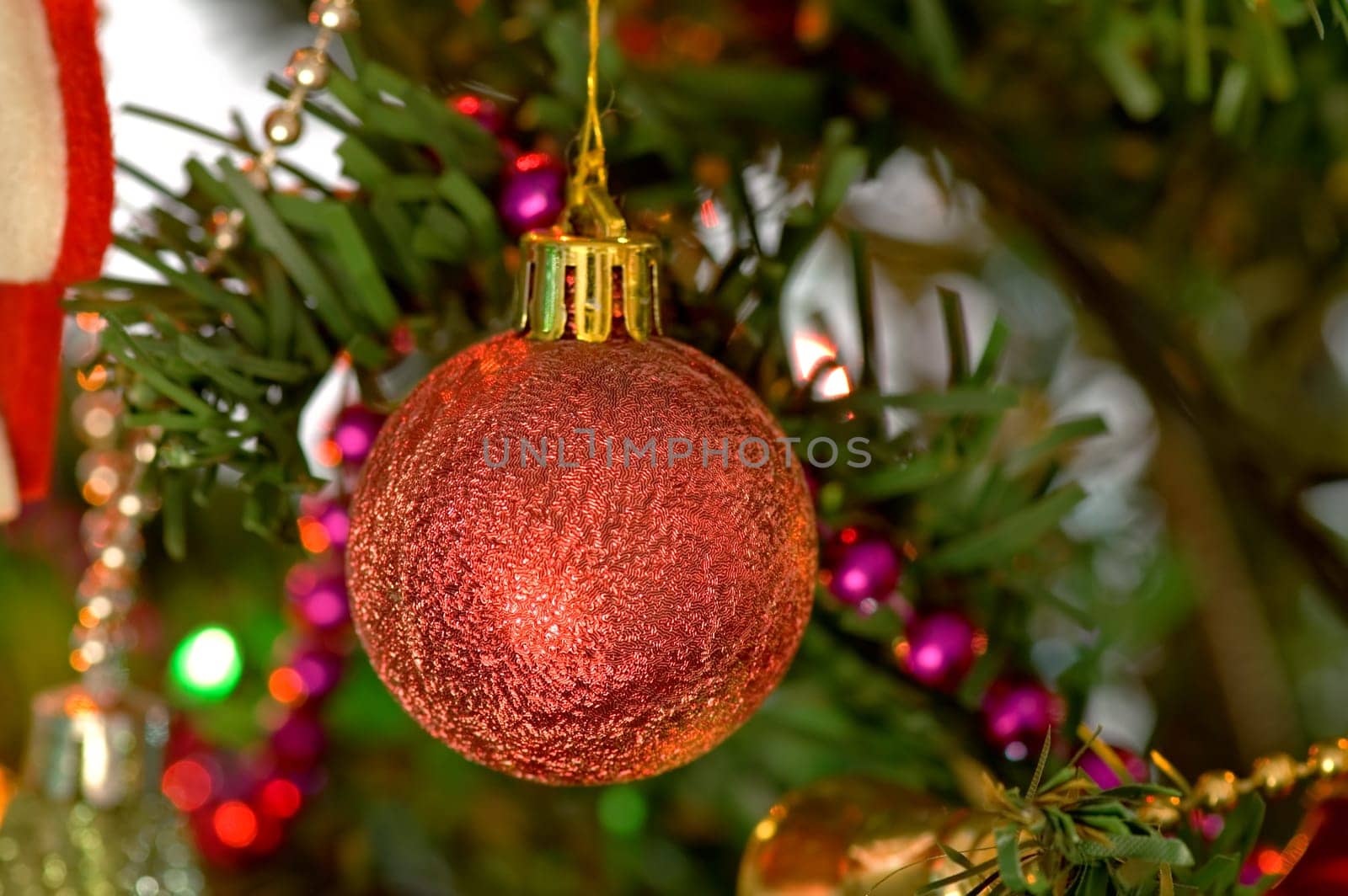 Some christmas balls decorated on a tree