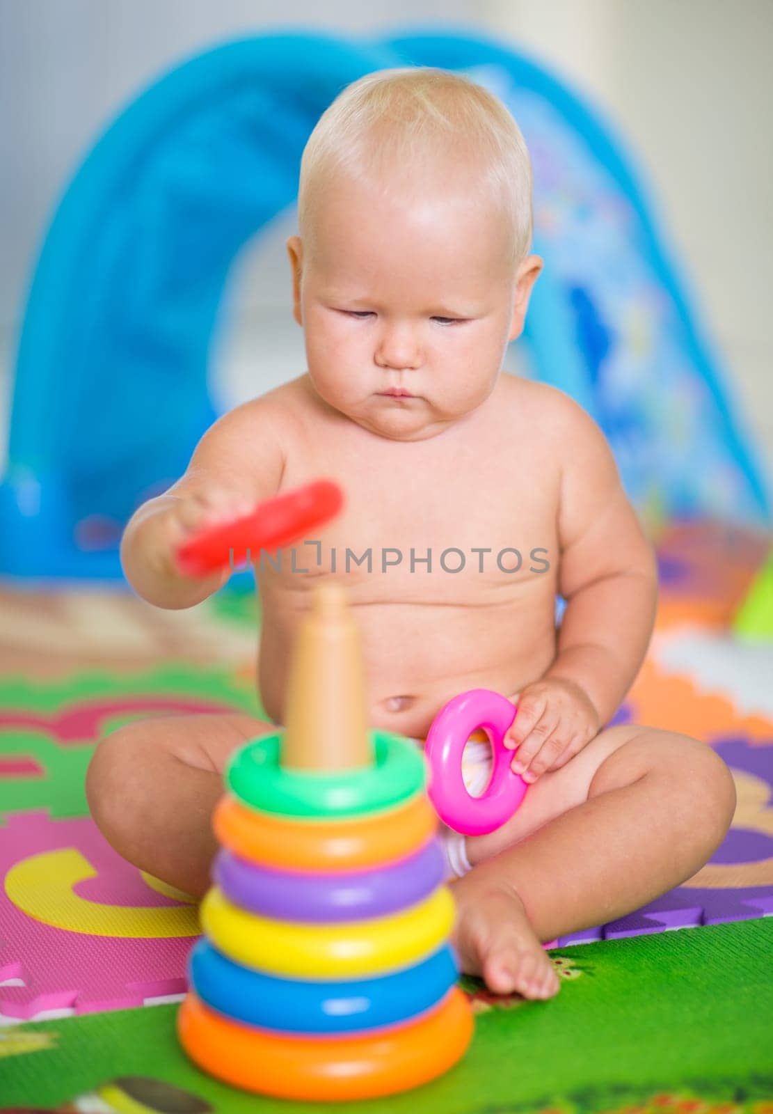 Cute baby is playing toy