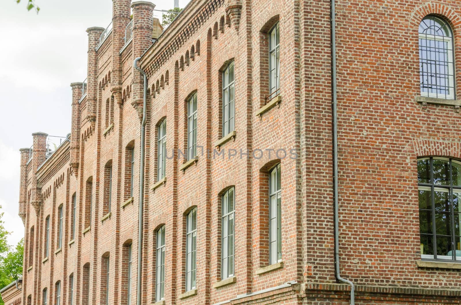 Historic old town house made of brick after the renovation for condominiums.