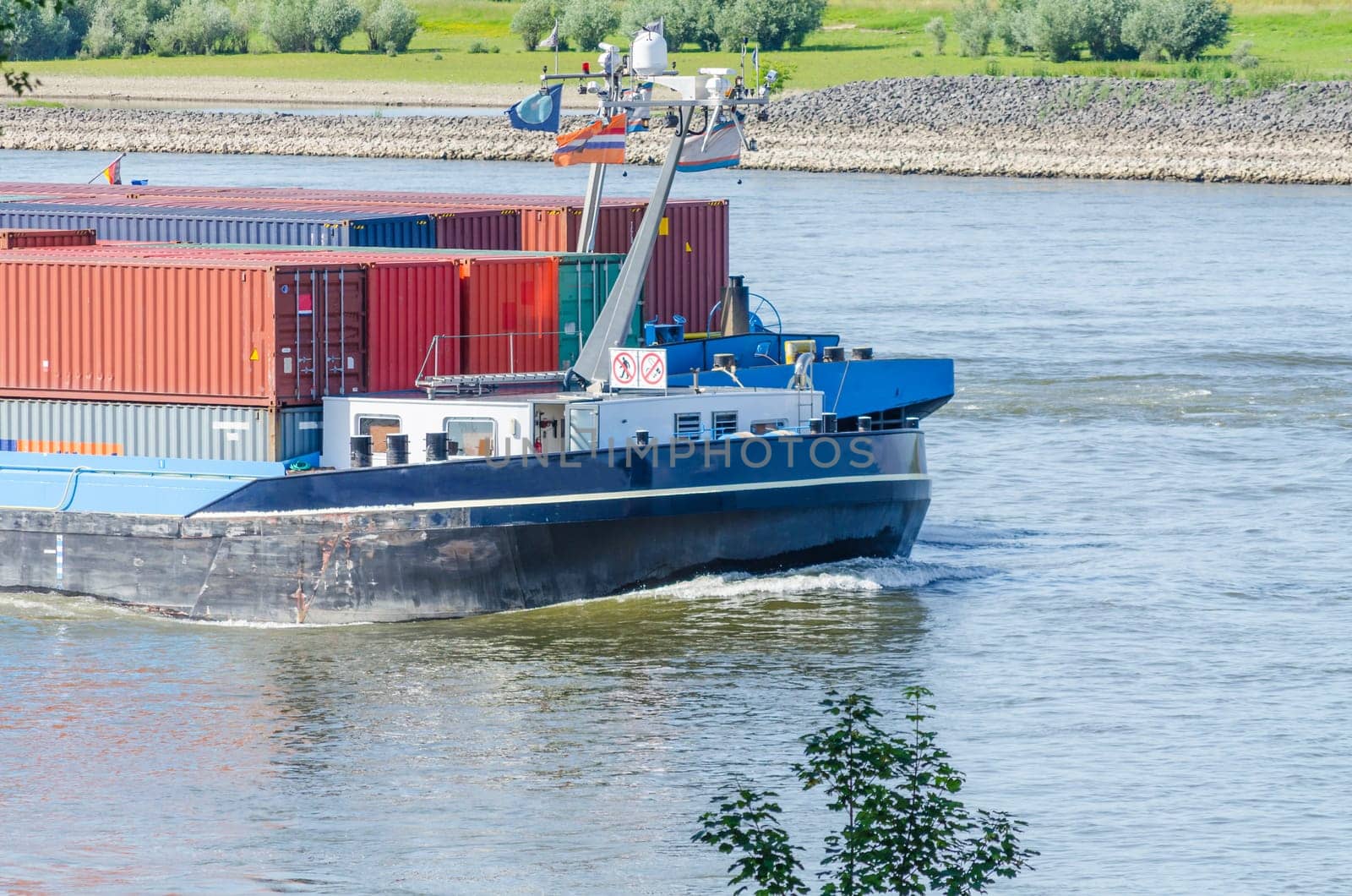 A container ship on the Rhine near Meerbusch,it is designed for sailing on inland waters and inland waterways.