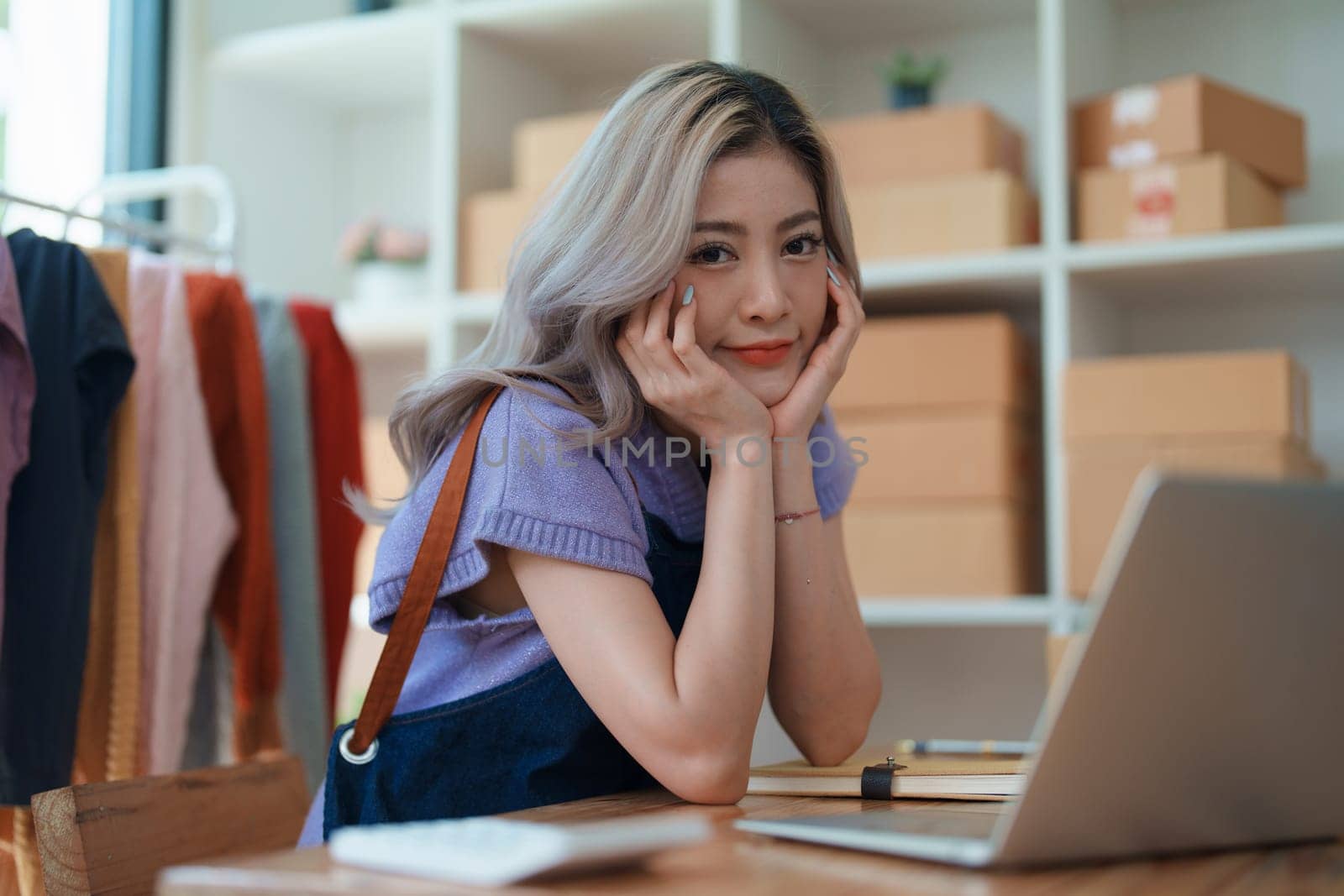 Portrait Of Asian Female Owner Of Fashion Store Clothing Store successful happy smile at small business, sme or ecommerce concepts by Manastrong