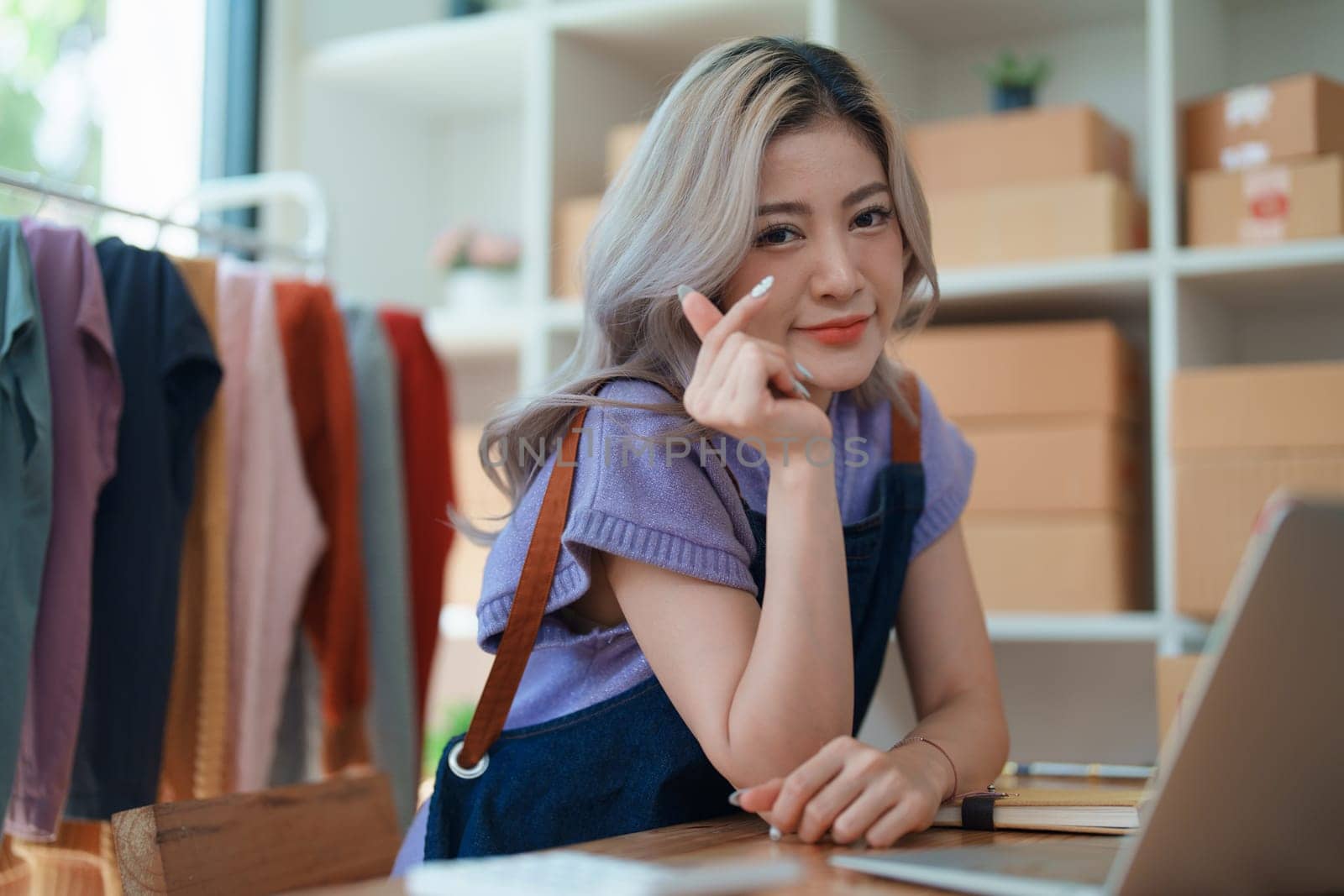 Portrait Of Asian Female Owner Of Fashion Store Clothing Store successful happy smile at small business, sme or ecommerce concepts by Manastrong