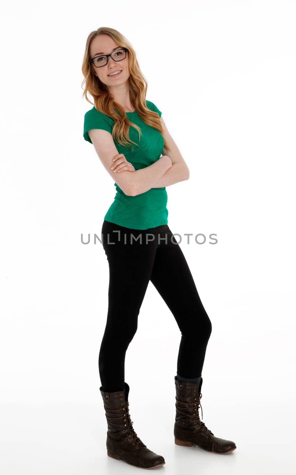 Full length photo of teenage girl standing on white background.