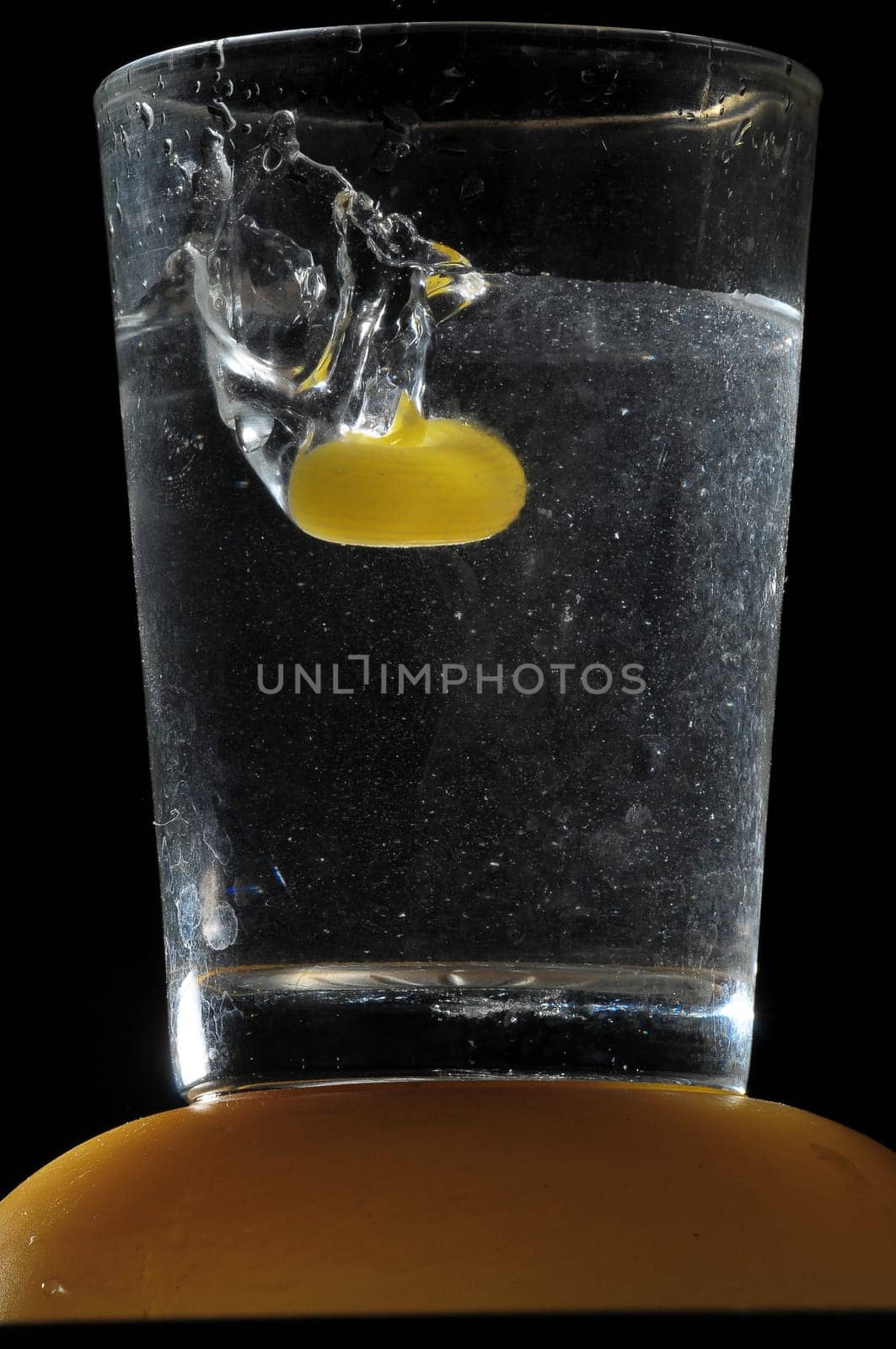 Healthy Food Italian Pasta Splashing in Water over a Black Background
