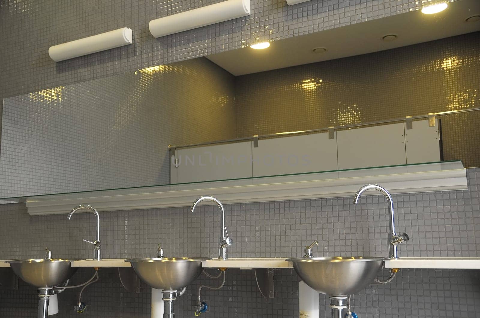 An Interior of a Private Restroom with Mirror