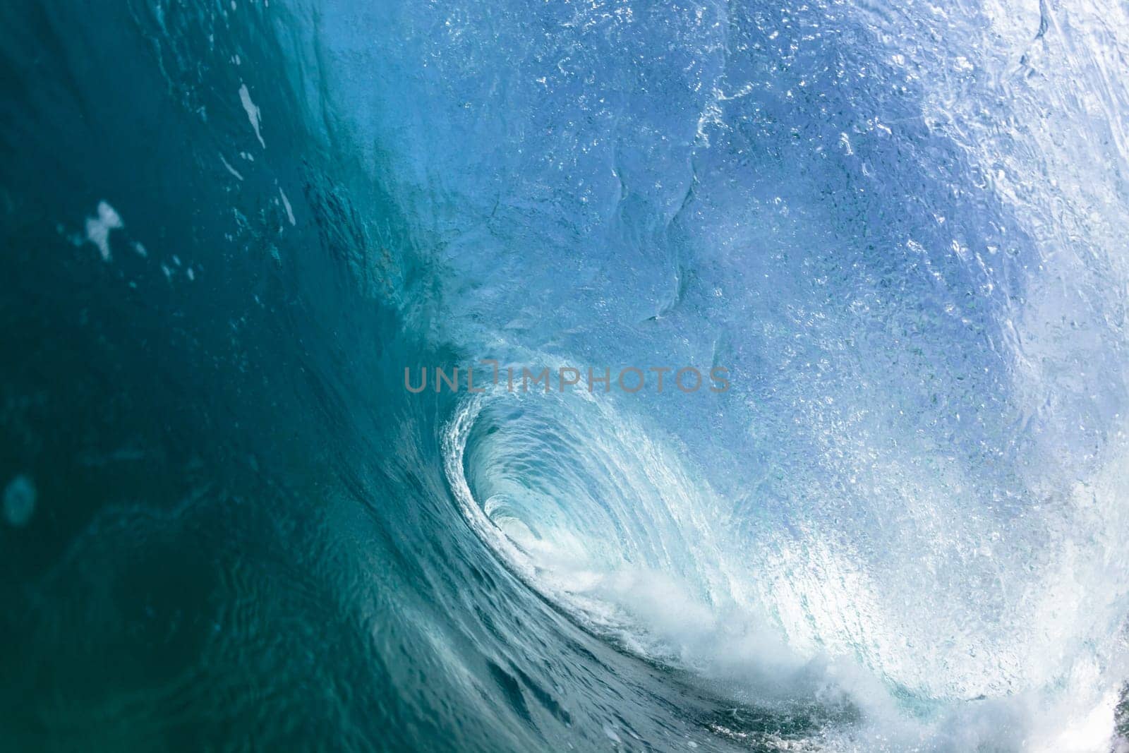 Ocean sea wave vertical crashing hollow tubing water power on shallow beach reefs sandbars, a swimming surfer action water photo
