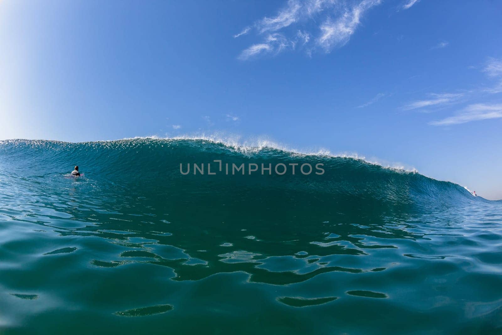 Ocean sea wave vertical crashing hollow tubing water power on shallow beach reefs sandbars, swimming water photo