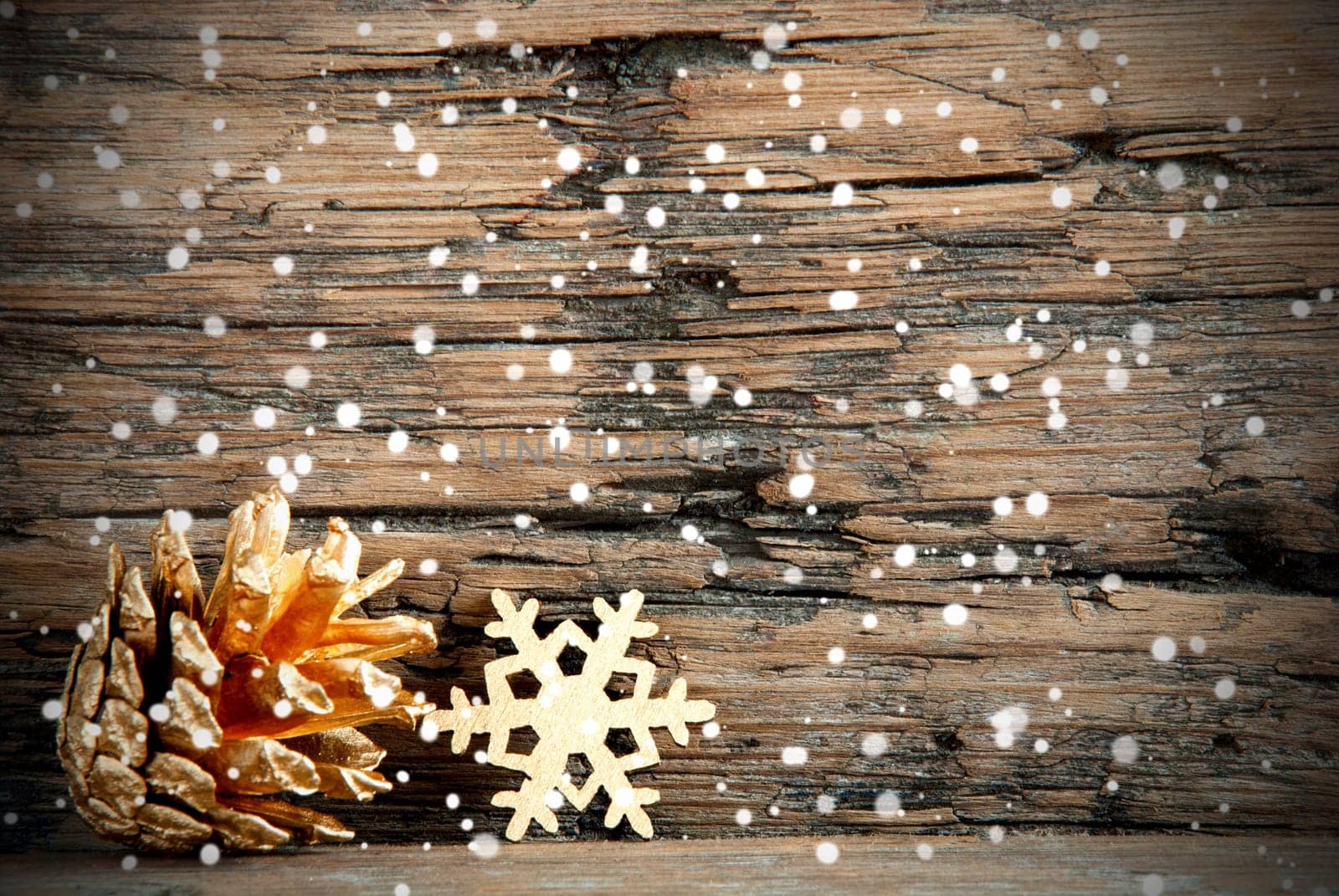 Golden Christmas Decoration on Wood with Snow