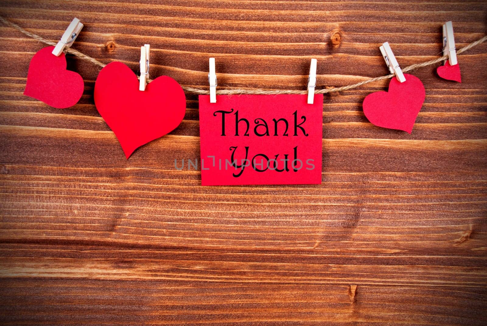 Thank You written on a red Tag with many Hearts on a Line