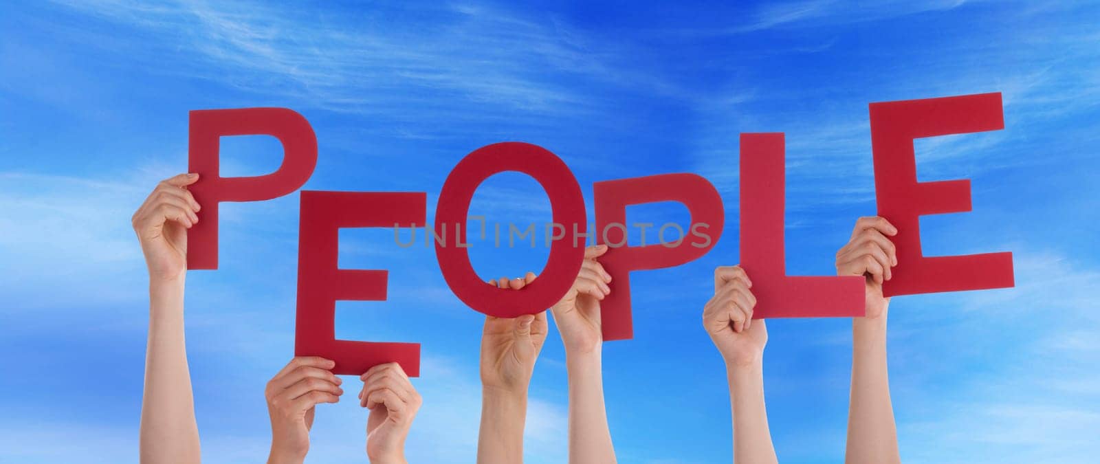 hands holding four pieces of a puzzle with copy space, gray background