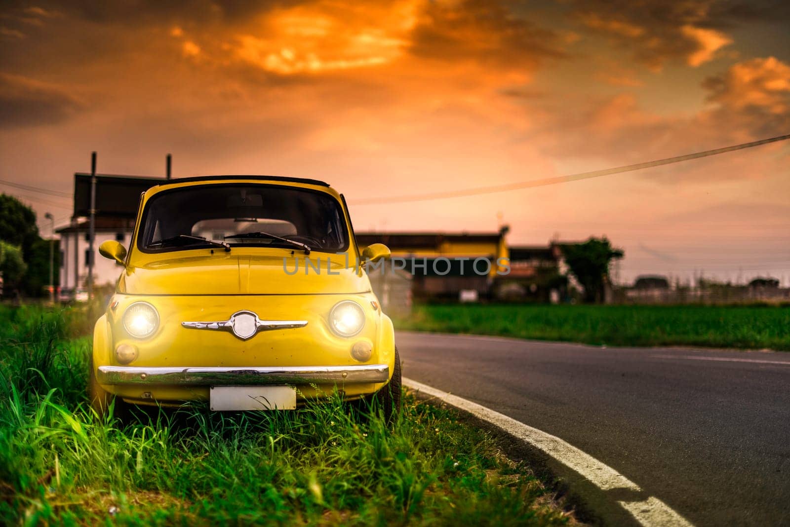 Small vintage italian car Fiat Abarth. Yellow color