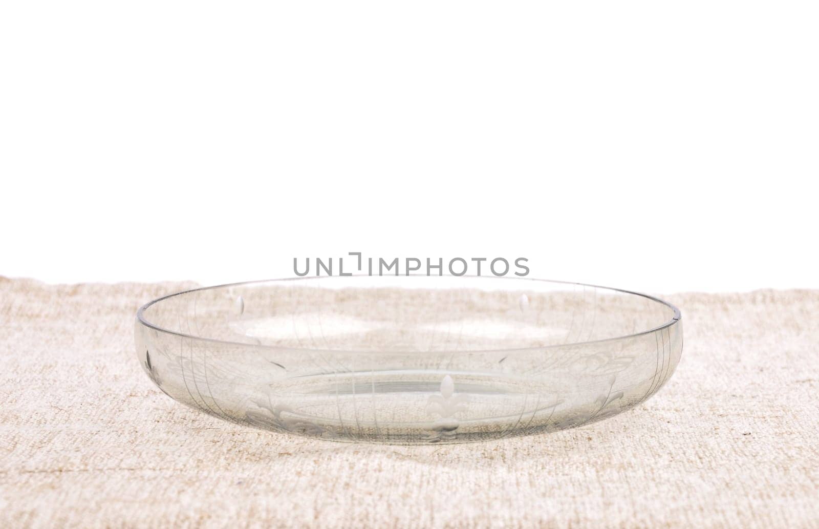 Glass bowl on linen cloth