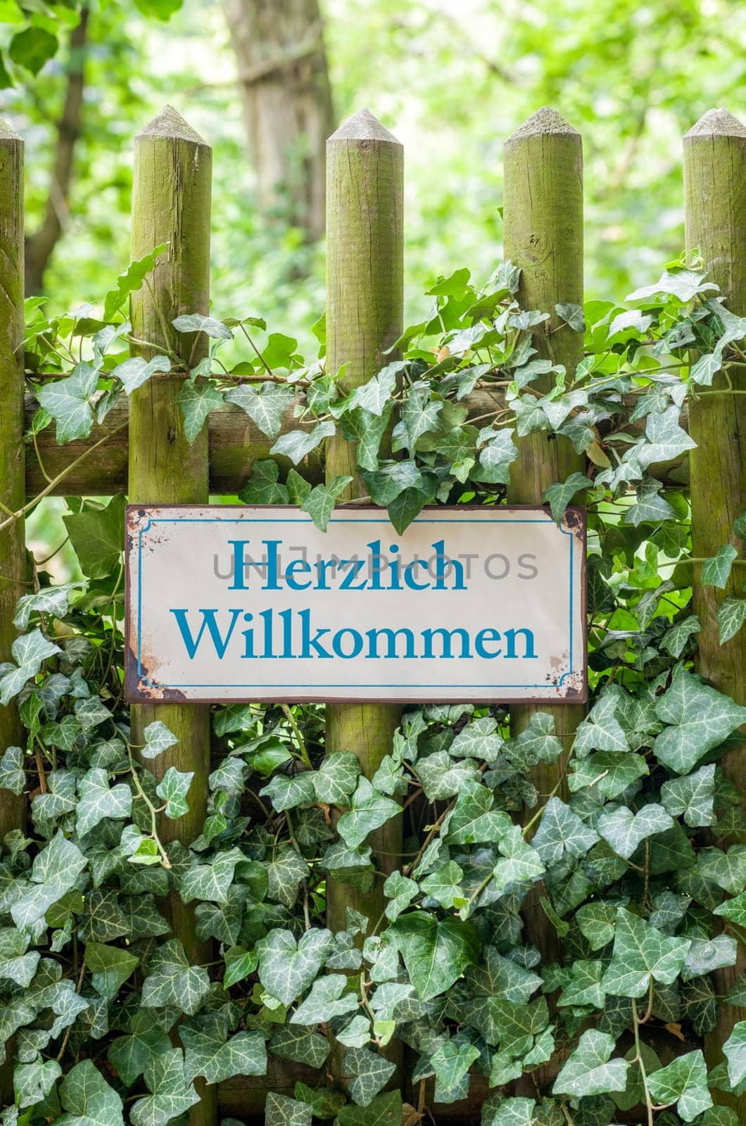 Old tin sign with inscription Welcome