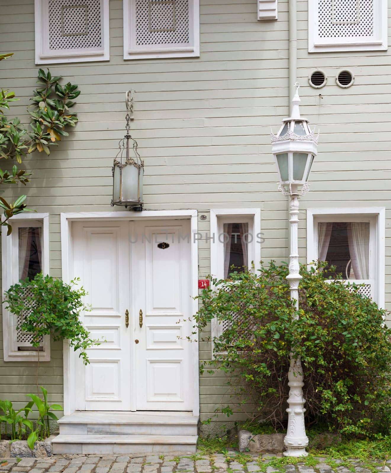 detail of a wooden house with lantern