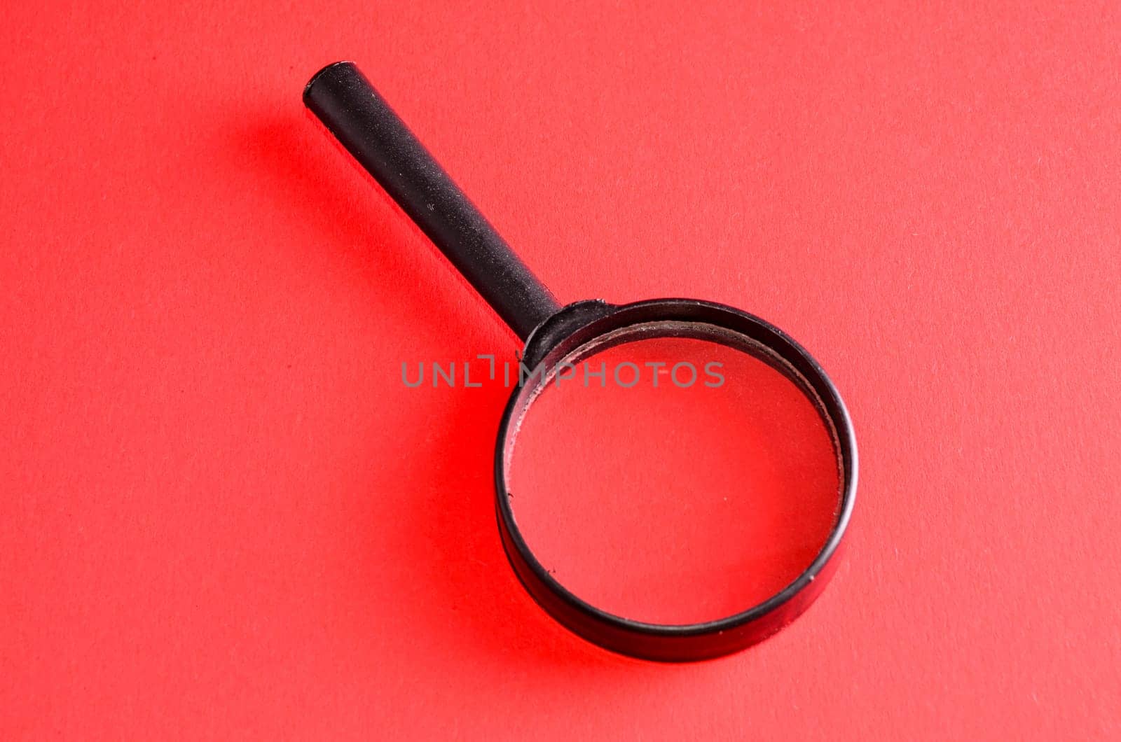 Vintage Magnify Glass Loupe on a Colored Background