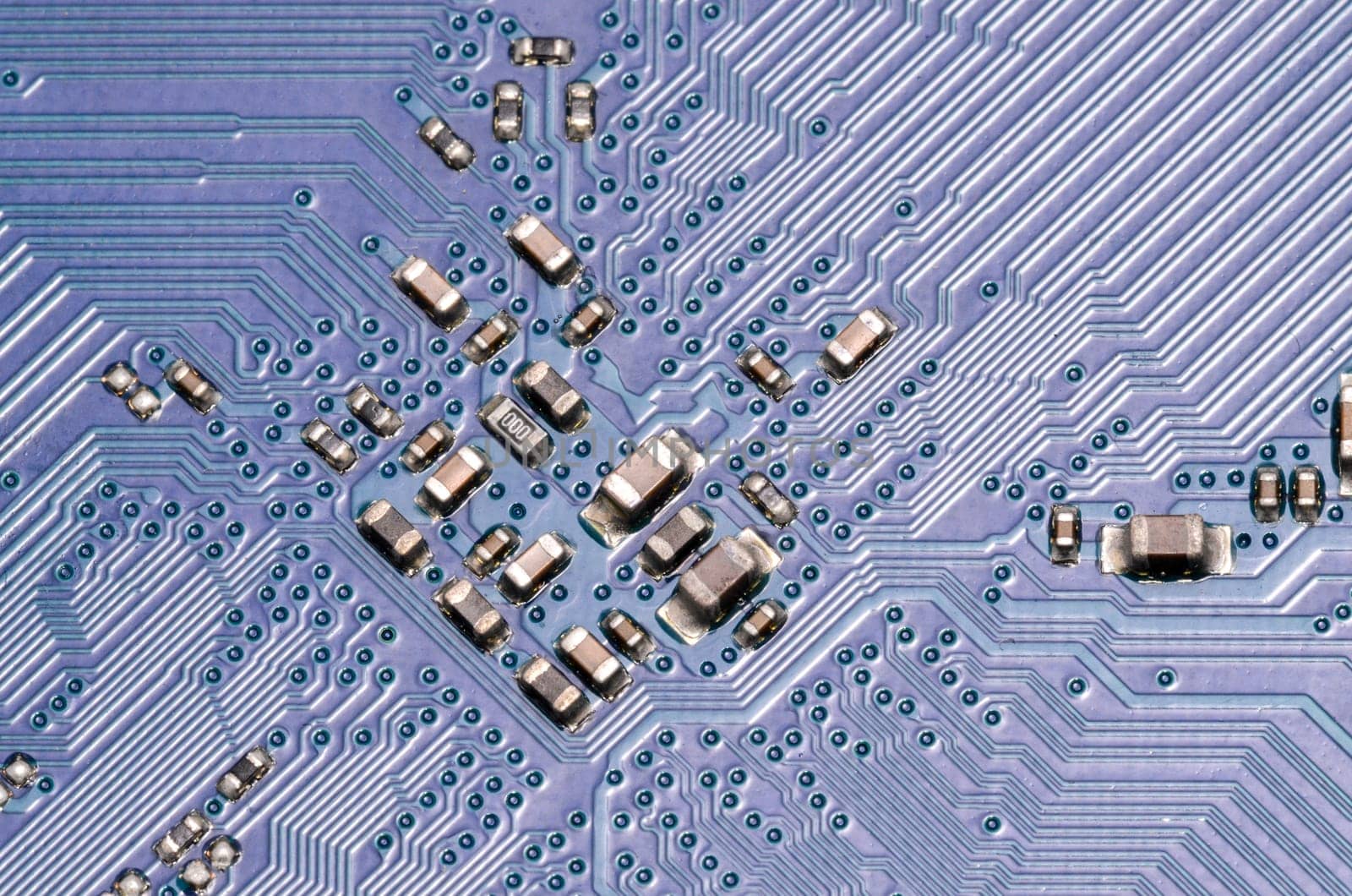 Macro Photo Of Electronic Circuit. Pcb On The Lighting.