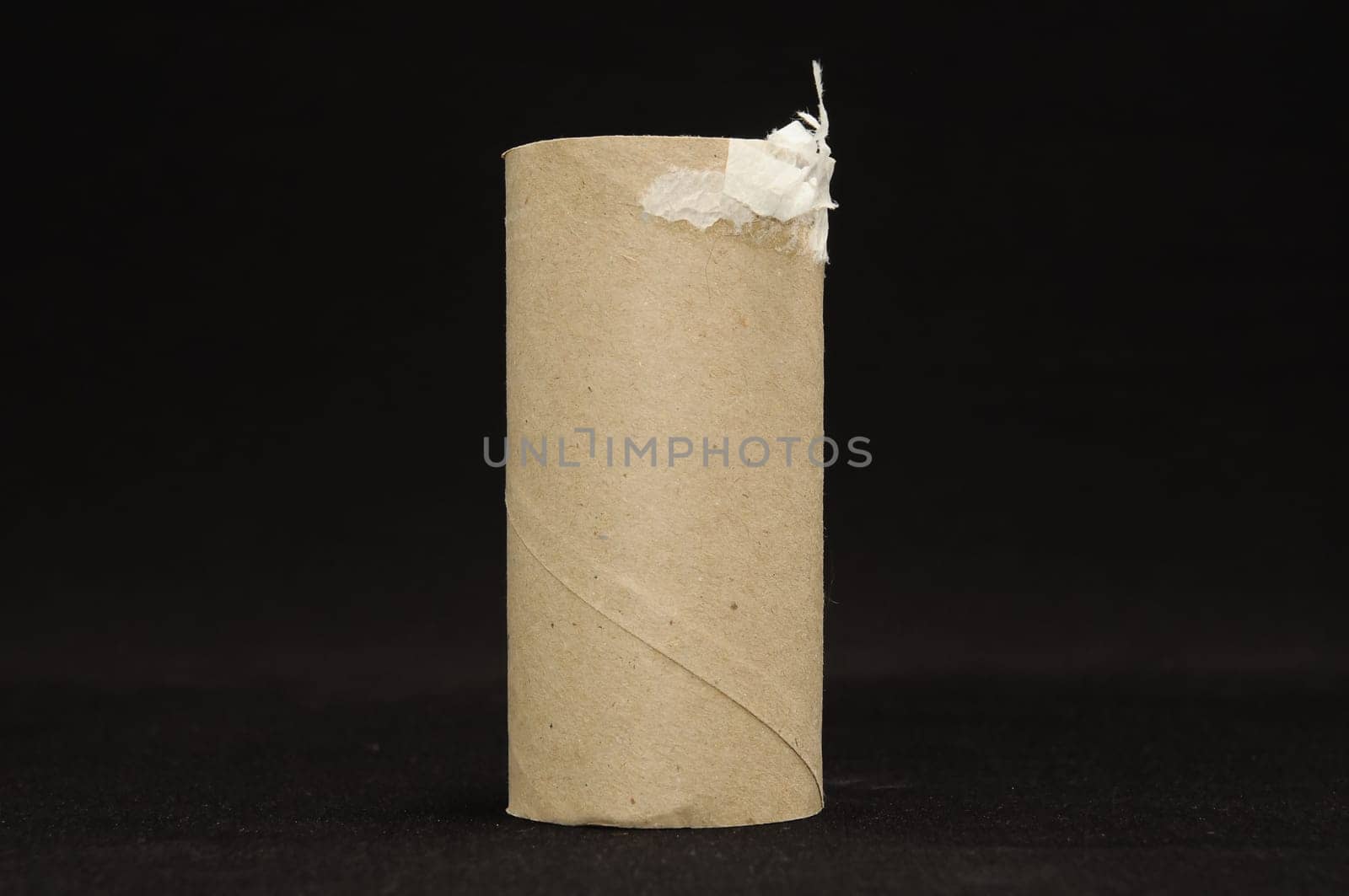 Empty Toilet Rolls Stack Up On a Black Background