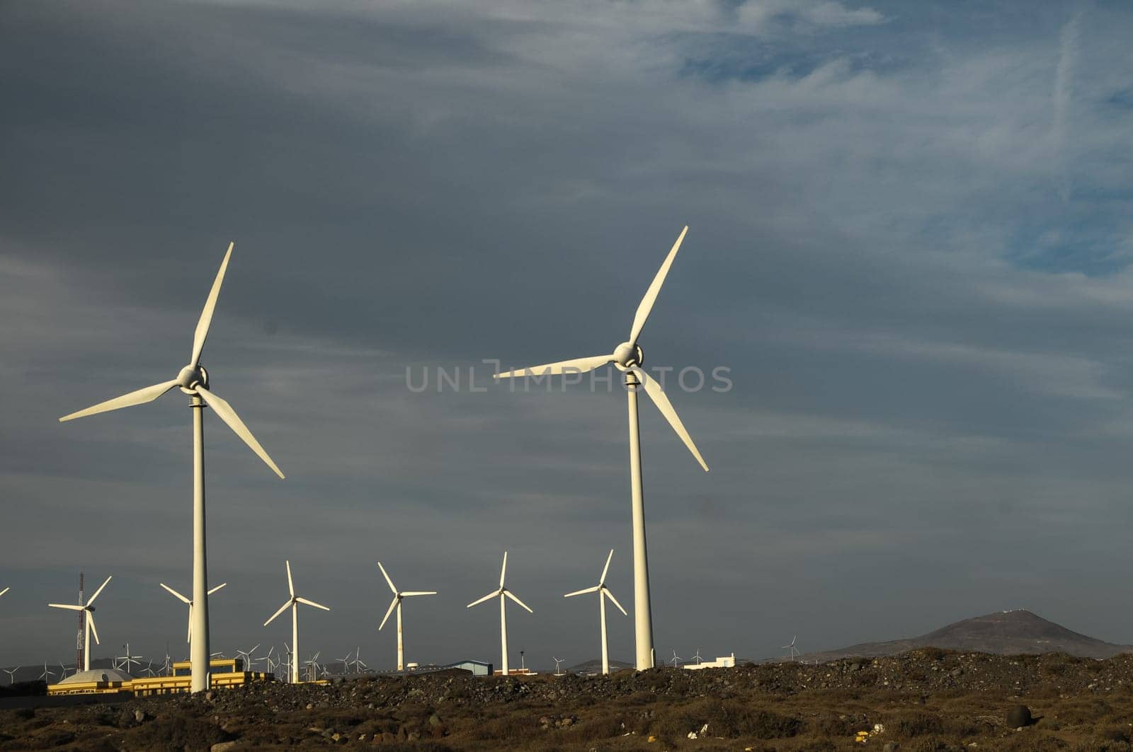 Eletric Power Generator Wind Turbine over a Cloudy Sky