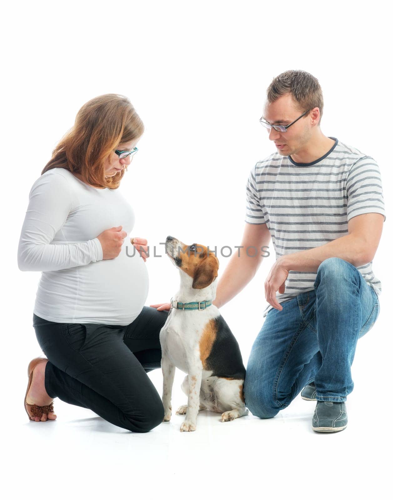 Expectant parents with dog
