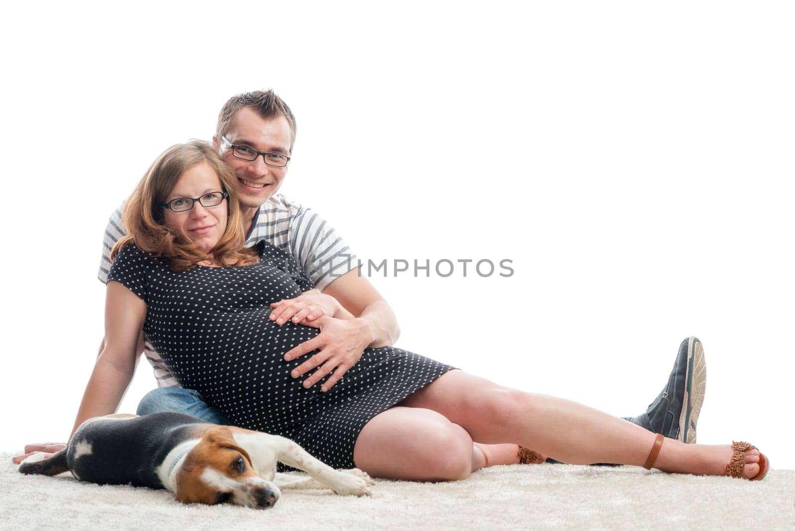 Expectant parents with dog