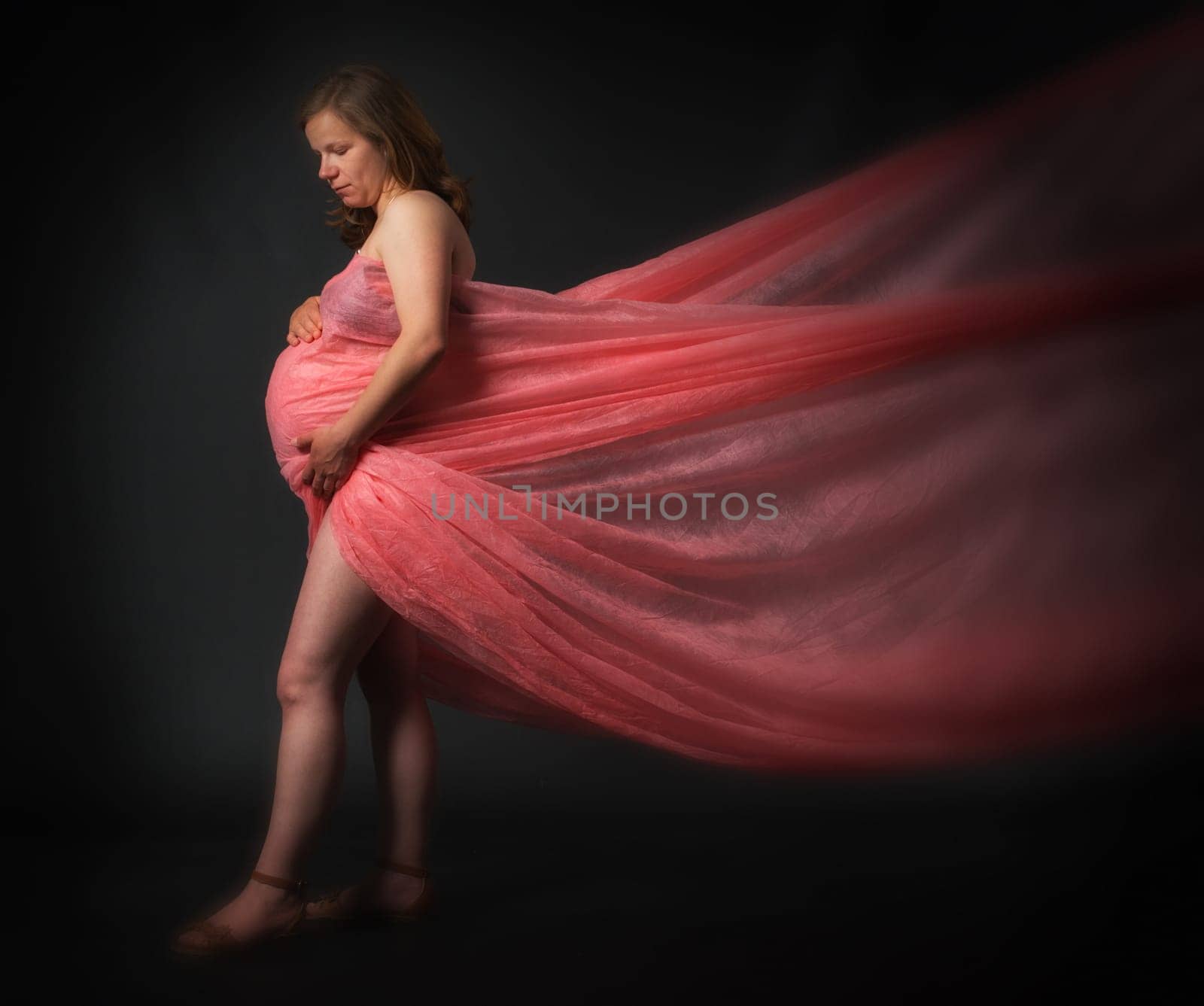 Pregnant woman in tulle dress