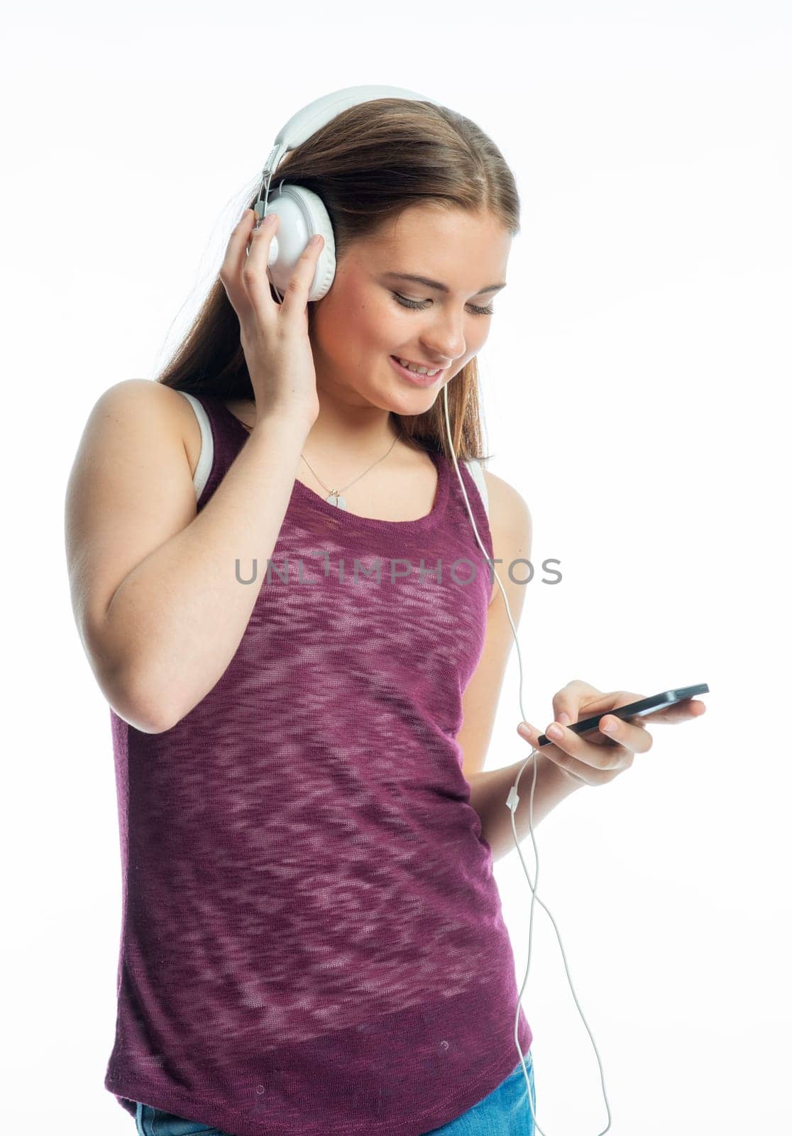 Girl with mobile phone and headphones