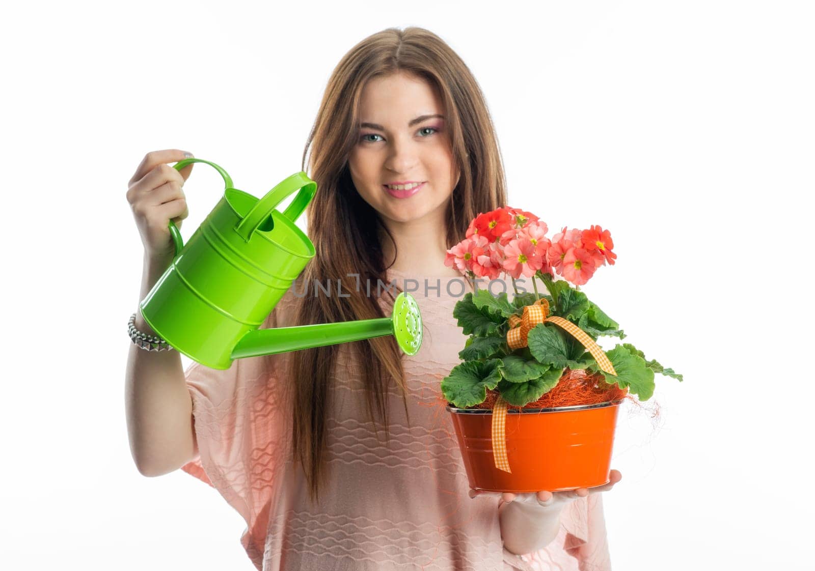 Girl with potted plant and watering can