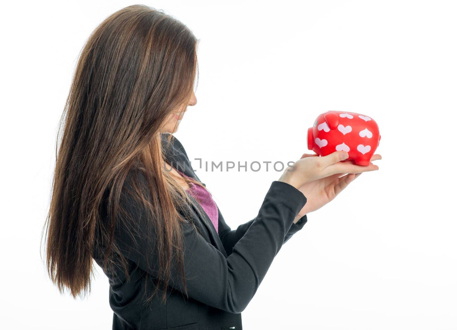 Young girl with piggy bank