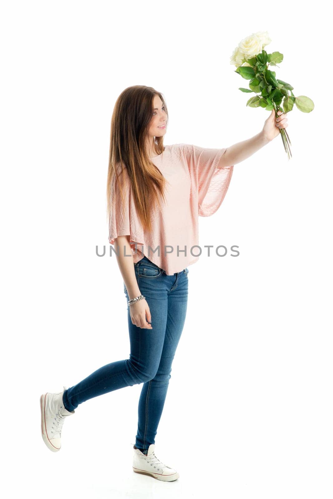 Young girl holds a bouquet of flowers