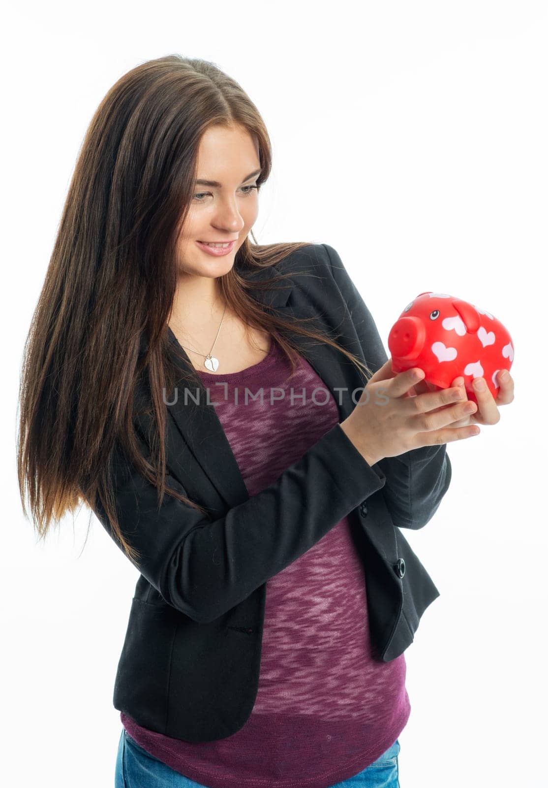 Young girl with piggy bank